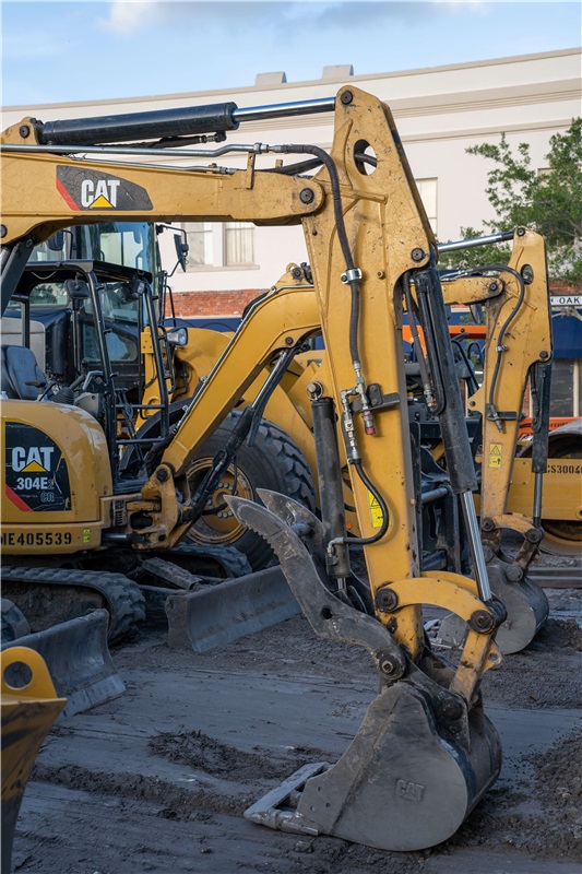 Adding auxiliary hydraulics to an excavator